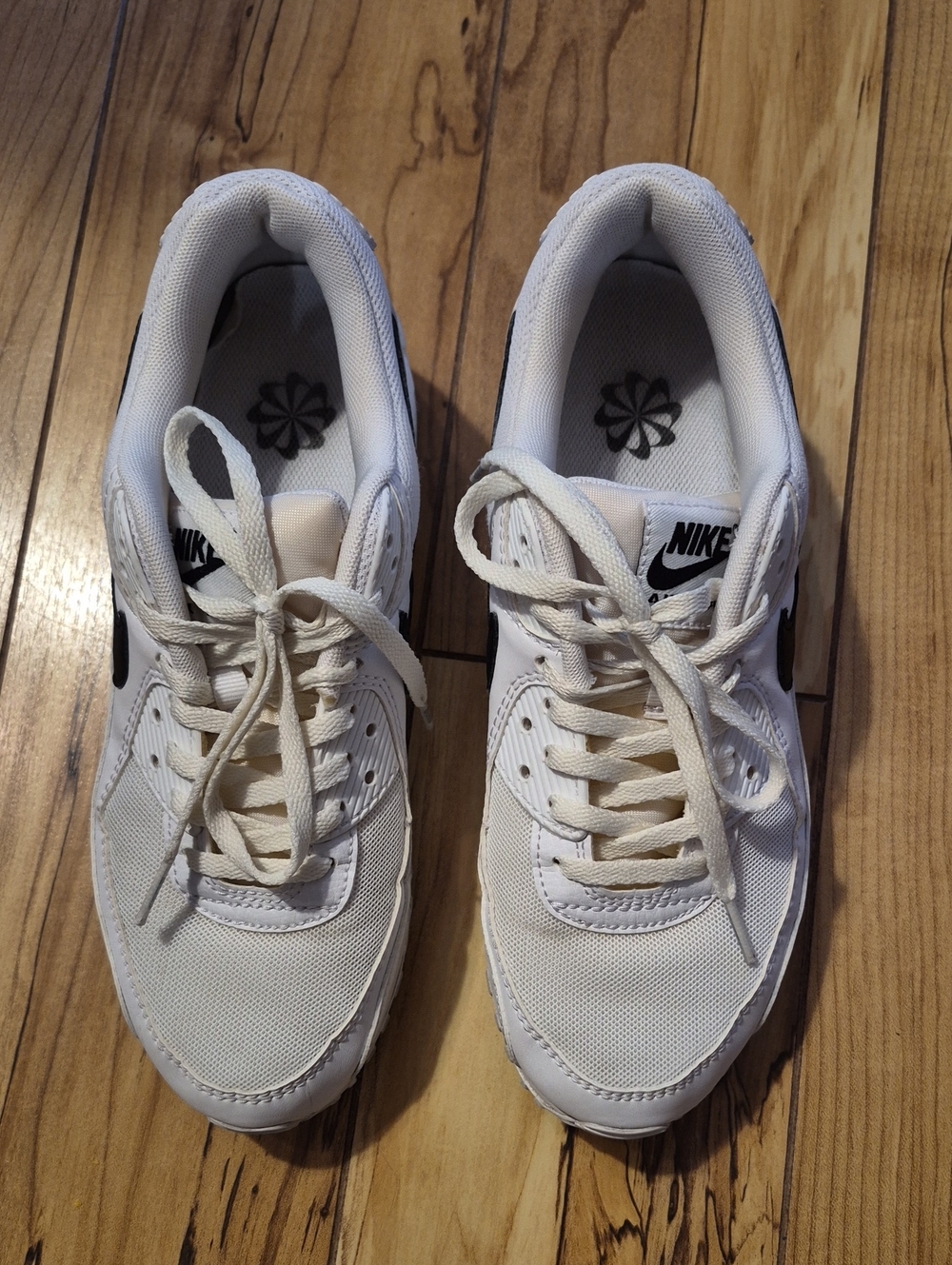 Nike White Low-Top Sneakers with Black Swoosh